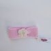 Fascia bambina rosa con fiore  in pura lana merinos 100% lavorata a mano