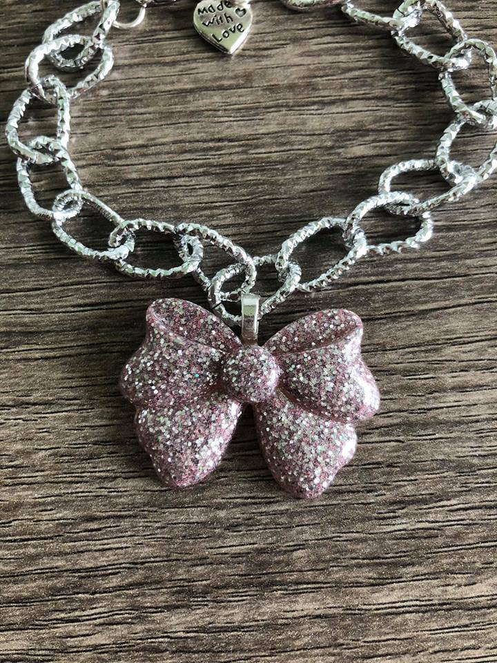 Bracciale forzatina con fiocco centrale in argento 925 rodiato zirconi