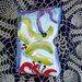 Contenitore per zampirone, manufato di ceramica dipinto con motivi astratti con colori vivaci