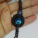 Bracciale nero con perla azzurro trasparenye