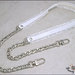 Tracolla per borsa lunga cm.85 - similpelle lucida bianca, impunturata con doppia gala, catena argento o oro 