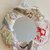 Specchio tondo pezzo unico 40 cm di diametro  lavorato ad uncinetto con fettuccia bianca a cui sono state applicati  legnetti conchiglie ed altre decorazioni tema mare