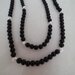Collana realizzata con perle nere ed inserti di perle  filigranate di color argento