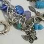 Bracciale azzurro con campanellina Chiama angeli portafortuna. Elefante. Farfalla. Braccialetto