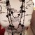 Collana sciarpa realizzata all'uncinetto (lunghezza oltre 3 metri) con perle di onice ed ematite