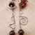 Orecchini pendenti in alluminio battuto, cristalli Swarovski e perle in ceramica greca. Monachelle in acciaio