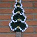 Fuoriporta natalizio fatto a mano all'uncinetto a forma di albero di Natale 