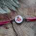 bracciale fucsia con fiore.