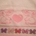 Asciugamanino di spugna rosa con fiocchetti