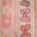 Asciugamanino di spugna rosa con fiocchetti