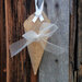  10 jute cones 19 cm. with satin ribbon or string for hanging.
