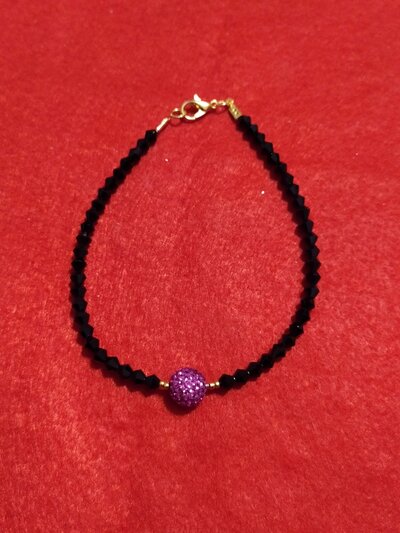 Bracciale con cristalli neri e con perla rosa in Swarovski Bracciale con cristalli neri e con perla rosa in Swarovski