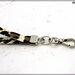 Cinturino staccabile da polso,  lungo 21 Cm. in similpelle leopardata finiture colore argento 