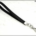 Cinturino staccabile da polso,  lungo 21 Cm. in vero cuoio nero inciso, finiture colore argento 