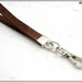Cinturino staccabile da polso,  lungo 21 Cm. in vero cuoio marrone inciso, finiture colore argento 