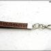 Cinturino staccabile da polso,  lungo 21 Cm. in vero cuoio marrone inciso, finiture colore argento 