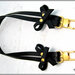 Manico per borsa, 62 cm. in cuoio nero, ha 2 fiocchi laterali in cuoio, rivetti e moschettoni extra lusso colore oro