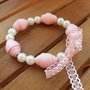 Bracciale rosa con perle