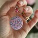 orecchini in legno e carta origami colore rosa e argento, fantasia fiori e pendenti a cerchio. serie Japan