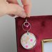 orecchini in legno e carta origami colore rosa e argento, fantasia fiori e pendenti a cerchio. serie Japan