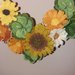 Ghirlanda con coccinella e fiori di feltro