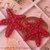 Orecchini pendenti all'uncinetto con stelle marine e pietre rosse 