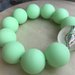 Bracciale con perle verde fluo