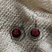 orecchini acciaio fiore rosso su base nera