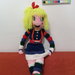 Bambola amigurumi colorata