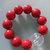 Bracciale elastico con perle rosse 