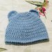 Cappellino coniglietto  in lana realizzato ad uncinetto neonato