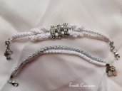 Braccialetti bianco e argento con charms ed elemento centrale con perle e strass