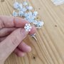 25 pcs Fermacampioni fiocco di neve bianco 12x14mm