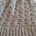 Per Natale un cappello unisex  realizzato a uncinetto con filato di lana color grigio
