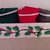 Cestino bianco decorato con ramo di vischio ed all'interno tre asciughini color rosso, verde bottiglia e verde felce con contorno di merletto