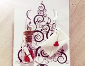 Orecchini natalizi pendenti lettera con bottiglia piena di cuori e pergamena in fimo 