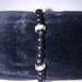 Braccialetto realizzato a mano con perle nere e distanziatori con brillantini