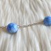 Collana con perle e pendente in pasta di mais bianco e azzurro variegato