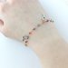 Bracciale in acciaio e perline rosse arancio beige con ciondoli a forma di chiave fatto a amano