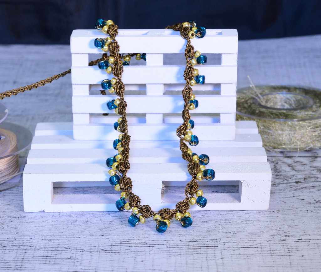Caucciù con scanalatura - 5x4 mm - Bronzo - 50 cm - Perline Fimo & Co