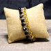 Bracciale boho chic realizzato all'uncinetto, con cristalli cechi e perline giapponesi. Bottone in metallo dorato effetto vintage