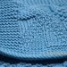 Copertina di lana azzurra per carrozzina