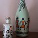 ornamento stilizzato in bottiglia