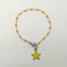 Bracciale stile rosario in acciaio realizzato a mano, cristalli gialli e ciondolo stella gialla.