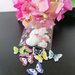 Sacchetto porta confetti con cuoricini fucsia e  rosa e farfalla in legno 
