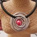 Collana girocollo in silicone con pendente centrale in allumino e perla in ceramica greca