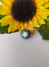 Perla con stella in silicone alimentare 15 mm. *Grigio*
