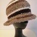 Cappello lana marrone a righe
