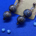 Orecchìni con perle in vetro colore Bronzo e inserti striati colore Turchese 