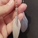 Orecchini a piuma lunga bianca ( perlina trasparente )